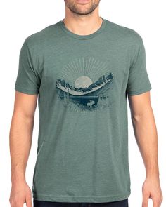 Our Glacier National Park tee showcases one of our favorite views in the park printed with an earthy color scheme on our dusty pine colored tee. The artwork is then lightly textured with topographic maps from the area, giving the print that warm and well-loved look and feel. This is an easy care, comfortable t shirt that you'll feel comfortable wearing all day. It can be a great souvenir remembrance of your vacation to Glacier. Or give it as a birthday gift or Christmas gift to friends and famil Outdoor Green T-shirt With Graphic Print, Green Graphic Print Outdoor T-shirt, Green Graphic Print T-shirt For Outdoor, Green Graphic Tee For Outdoor, Green T-shirt For Outdoor Activities, Green Graphic Tee For Outdoor Activities, Green Printed T-shirt For Outdoor Activities, Green Graphic Print Outdoor Shirt, Green Graphic Print Shirt For Outdoor