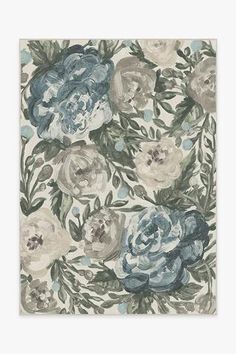 an area rug with blue and white flowers on it