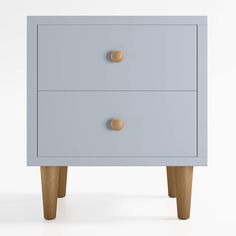 a blue chest of drawers with wooden legs and knobs on each drawer, against a white background