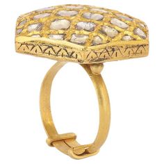 Handmade in 22k gold with 2.60 cts of uncut diamonds , this statement ring takes its inspiration from the ‘Jali’ work of Mughal Architecture . The result is a unique blend of tradition with a contemporary edge . The beautiful ‘Partash’ work at the back of the ring is an age-old craft of hand- inlaying and carving on sculpted gold to create patterns,