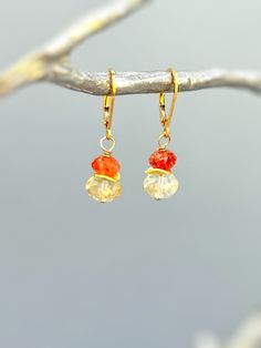 Colorful dangly drop orange Oregon sunstone and yellow citrine dangle earrings in your choice of gold fill, rose gold fill, or sterling silver.  A lovely gift for a mom, wife, or girlfriend. Handmade November birthstone gemstone jewelry for women. Handmade Jewelry crafted with love one at a time in my northern Michigan studio. Gemstones are nature's creations and may vary slightly in color and inclusions, but all are lovely and hand selected to match. These earrings are Dainty approx 1 1/4"  lon Orange Gemstone Dangle Earrings, Amber Dangle Earrings With Ear Wire, Amber Citrine Dangle Earrings, Orange Gemstone Drop Earrings, Orange Teardrop Gemstone Earrings, Orange Teardrop Citrine Jewelry, Elegant Everyday Orange Jewelry, Orange Gemstone Dangle Jewelry, Gold Citrine Dangle Earrings