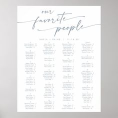 a white wedding seating chart with blue calligraphy