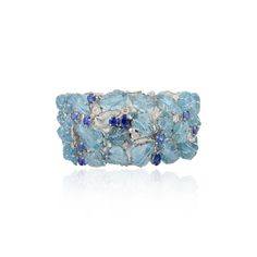 This is part of Chairish’s Fine Jewelry assortment.  This Regal 133.15 CTW Aquamarine Sapphire Wide Bracelet for Wedding in 18K gold showcases 133.15 carats endlessly sparkling natural aquamarine nd sapphire and 1.95 carats of diamond. It measures 7.5 inches long in length.  Aquamarine is useful for moving through transition and change and sapphire stimulates concentration and reduces stress. Designed with carved aquamarine and mixed cut sapphires and diamond set in solid gold to make you stand Luxury Blue Bracelets With Gemstone Accents, Luxury Blue Topaz Gemstone Bracelets, Luxury Blue Topaz Bracelets, Luxury Blue Wedding Bracelets, Luxury Blue Bracelets For Wedding, Wedding Bracelets With Blue Topaz Gemstones, Blue Topaz Gemstone Bracelets For Wedding, Bracelet For Wedding, Wide Bracelet