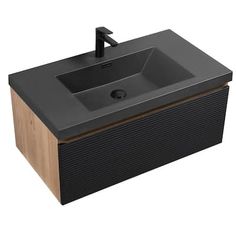 a black sink sitting on top of a wooden counter