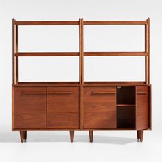 the sideboard is made out of wood and has two open shelves on each side