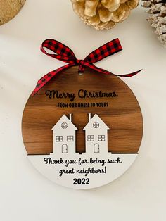 a christmas ornament with a house on it