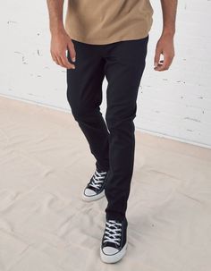 RSQ Slim Chinos. Formerly known as the "London Skinny Chino Pants". Skinny straight leg. Slant front pockets with welt back pockets. Zip fly. Button waist. 97% cotton/3% spandex. Machine wash. Imported.Model is 6'2.5" wearing a size 31x32.Approx outseam: 40.5" Approx leg opening: 14.5" Fitted Bottoms For Business Casual, Casual Black Bottoms With Button Zip Fly, Casual Slim Fit Trousers, Casual Fitted High Waist Chinos, Fitted High Waist Casual Chinos, Trendy Business Casual Bottoms With Button Closure, Casual Stretch Pants With Button Zip Fly, Slim Fit Spring Pants With Standard Cut Leg, Spring Business Casual Pants With Standard Cut Leg