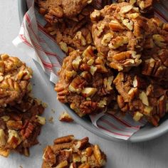 a bowl filled with cookies and nuts on top of a table