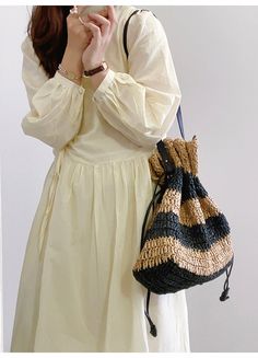 In Stock Fast Shipping From Los Angeles Saddle up for summer with the Elena Handbags Fashion Stripe Straw Drawstring Bag! This stylishly striped straw bag is the perfect accessory for the sizzle season. With its drawstring closure and light-as-air feel, it's the ideal accessory to cinch up your style. Saddle up and look sharp! Size: 38cm wide x 31cm tall (15in x 12in) Designer Style ID: 8482 Large Fashion Straw Woven Tote Bag, Vintage Vibes, Summer Bag, Everyday Shoulder Bag, Beach Bag Black Straw Bag For Spring Vacation, Spring Black Straw Beach Bag, Casual Straw Bucket Bag For Spring, Black Straw Bag For Summer Day Out, Striped Shoulder Bag For Daily Summer Use, Striped Shoulder Bag For Daily Use In Summer, Summer Black Straw Bag For Day Out, Striped Summer Style Bag, Spring Black Beach Bag With Braided Handles