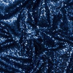 the blue fabric is very shiny and it looks like it has been made from sequins