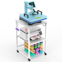 a machine that is sitting on top of a cart filled with crafting supplies and toys