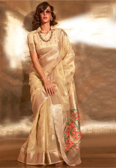 Art Silk Saree in Cream This drape is Enhanced with Resham, Zari Woven in Ornamental and Abstract Motifs Available with an Unstitched Art Silk Blouse in Cream Do note: 1.)Accessories shown in image is for presentation purpose only. 2.)Slight variation in actual color vs. image is possible. 3.)Irregularities in weaving and contrast color is natural due to hand-done dying process Tissue Fabric, Tissue Saree, Indian Wedding Wear, Utsav Fashion, Art Silk Sarees, Soft Silk Sarees, Traditional Sarees, Silk Material, Party Wear Sarees