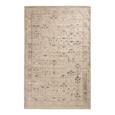 a beige rug with floral designs on it