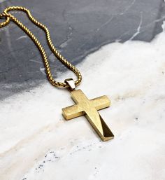 "《《 SPIRITUAL COLLECTION 》》 THE DETAILS The \"RUSTIC GOLD CROSS\" is designed with a shiny Mirror Finish Gold Stainless Steel Cross Pendant with an exquisitely engraved Brushed Stone like pattern, hung from a Gold Stainless Steel Box Chain available in your choice of length! 💠🔶️💠View entire SPIRITUAL COLLECTION here: https://www.etsy.com/shop/mrmackjewelry/?section_id=27046119 MATERIALS * 1 3/4\" × 1\" Gold Stainless Steel Cross Pendant * 3mm Gold Stainless Steel Box Chain * Gold Stainless St Gold Chain With Cross For Men, Gold Stainless Steel Spiritual Cross Necklace, Gold Spiritual Cross Necklace In Stainless Steel, Gold Stainless Steel Cross Necklace As Gift, Gold Stainless Steel Cross Necklace For Gift, Gold Stainless Steel Minimalist Cross Necklace, Gold Minimalist Stainless Steel Cross Necklace, Minimalist Gold Stainless Steel Cross Necklace, Gold Jewelry With Polished Finish For Father's Day