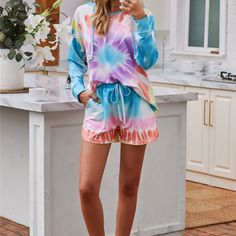 You'll Love This Cozy, Fun Tie Dye Loungewear Set Featuring A Tie Dye Hoodie And Matching Drawstring Short Set. Swirls Of Tie Dye In Turquoise, White, Orange, Pink, Yellow And Purple Detail The Soft And Stretchy Knit. Fit With A Drawstring Hoodie, And Front Pouch. New With Tags Loose Fit Fits True To Size Model Is Shown Wearing A Size Small Fabric Content Is 95% Polyester, 5% Spandex Each Set Has Its Own Unique Coloring. Your Set May Not Perfectly Match The Exact Coloring Of The One Shown Casual Drawstring Sleepwear For Spring, Casual Spring Sleepwear With Drawstring, Casual Blue Hooded Sleepwear, Casual Multicolor Hoodie For Loungewear, Hoodie Shorts, Tie Dye Loungewear, Crop Crewneck, Fun Tie, Victoria Secret Pink Sweatshirts