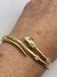 Vintage Snake Bangle Bracelet Gold filled Green Crystal Eyes
https://www.etsy.com/listing/1336074908/vintage-snake-bangle-bracelet-gold Yellow Gold Snake Chain Bracelet Gift, Elegant Snake-shaped Bangle For Gift, Elegant Snake Shape Bangle Gift, Elegant Snake Shape Bangle Perfect For Gift, Luxury Snake-shaped Bracelet Gift, Flexible Gold Snake Bracelet, Gold Snake Shape Bracelet As Gift, Elegant Snake-shaped Bangle As Gift, Snake Shape Gold Bracelet Gift