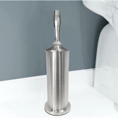 a stainless steel salt and pepper shaker on a white counter