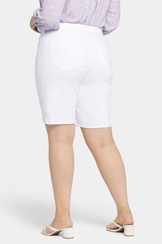 Play it cool and casual in the Boyfriend Shorts in Plus Size with Frayed Hems by NYDJ. This five-pocket pair has a relaxed longer fit designed to hit just above the knee. Our Lift Tuck® Technology uses a slimming panel with a criss-cross design to shape curves. Features a zip fly, button waist and frayed hems. This short is made with earth-friendly methods that result in reduced consumption of water, chemicals and/or energy. | NYDJ Women's Boyfriend Denim Shorts In Plus Size in Optic White, Size Spring Cotton Bermuda Shorts Mid-thigh Length, Stretch Cotton Straight Leg Shorts, Casual Mid-thigh Length Jean Shorts For Spring, White Relaxed Fit Straight Leg Jean Shorts, Stretch Mid-rise Cotton Bermuda Shorts, Casual Summer Jean Shorts, Casual Mid-thigh Length Summer Jeans, Summer Stretch Mid-thigh Length Jeans, Spring Cotton Bermuda Jeans