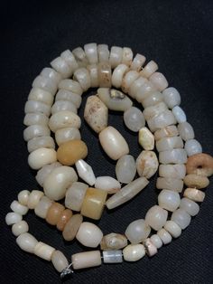 A collection of natural excavated white agate beads from ancient period as seen on its surface the patina. The holes are large and can be formed into a beautiful necklace or can be made in I individual pendants. All beads are in great condition and natural shaped Rondelle Natural Stones Beads For Jewelry Making, Handmade Rondelle Beads For Jewelry Making, Unique Round Gemstone Beads, Artisan Rondelle Polished Beads, White Gemstone Beads For Jewelry Making, Artisan Round Faceted Beads, Artisan Rondelle Beaded Beads, White Polished Rondelle Beads, Large Rondelle Beads For Jewelry Making