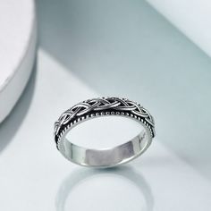 Our sterling silver spinner ring seamlessly combines the intricate beauty of Celtic knot design with the timeless allure of retro silver, making it an unmissable piece for both men and women who appreciate unique, artisancrafted jewelry.DetailsExpertly crafted from highquality sterling silver, this unisex spinner ring features an exquisitely detailed Celtic knot design that encircles the band. The ring boasts a retro silver finish, offering a nostalgic charm without compromising modern durabilit Silver Celtic Rings, Celtic Knot Designs, Celtic Knot Ring, Celtic Rings, Knot Design, Silver Spinner Rings, Luxury Rings, Spinner Ring, Celtic Jewelry