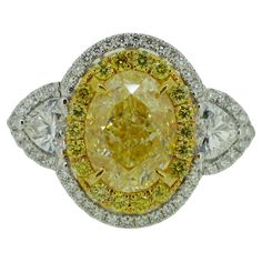 Stunning design for this incredible GIA diamond fancy light yellow ct 2, VS2 and side diamonds heart cut ct 0,37 G/VS-SI and around diamonds round brilliant cut.. Fancy Light, Fancy Lights, Fancy Yellow Diamond, Women Diamond, Yellow Diamond, Gia Diamond, Diamond Heart, Light Yellow, Solitaire Ring