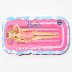 the barbie doll is laying on an inflatable mattress