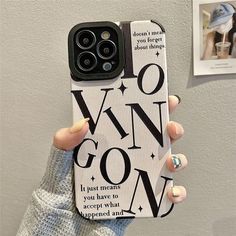 a woman holding up her phone case with the words wow on it