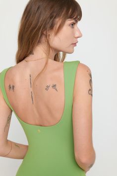 Short but sweet. A short-length bodysuit with a double-layer fabric at the chest, wide to narrow tapered straps, and a front and back scoop neckline. Made in our 4-way stretch Dream Tech eco-conscious fabrication that is compressive, moisture-wicking, quick-drying, and anti-odor. | Salem Shorts Bodysuit in Cactus Summer Tank Bodysuit With Built-in Bra, Chic Summer Bodysuit With Scoop Back, Summer Tank Top With Scoop Back And Seamless Construction, Summer Tank Top With Seamless Construction And Scoop Back, Summer Scoop Back Tank Top With Seamless Construction, Summer Bra-friendly Second-skin Tank Top, Summer Tank Top With Adjustable Straps And Tight Fit, Green Seamless Sleeveless Bodysuit, Summer Stretch Bodysuit With Scoop Back