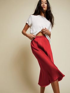 This luxe skirt with an elastic rib waistband and raw hem detail is cut on the bias, which means a perfectly slim fit that hugs all the right places. (This one comes in Crimson.) | Women's Mabel Skirt in Crimson | Ethical Essentials Bias Skirt, Nation Ltd, Bias Cut Skirt, All The Right Places, Midi Length Skirts, Wrinkle Remover, Midi Length, Elastic Waist, Slim Fit