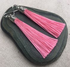 "Chic pink tassel earrings! They would add a pop of color to any outfit for any occasion. Dress them up or down. They are timeless and versatile. They are lightweight, fun and unique! The tassels measure 2 1/8\" long by 1/4\" wide. They hang from simple silver ear wire hooks. Overall drop length is about 2 1/4\". Metal is allergy free plated silver. These are my latest creation! I have them available in many colors! Find them all under the category tassel earrings in my shop. Thanks for stopping Pink Tassel Earrings As Gift, Pink Dangle Tassel Earrings For Gifts, Pink Tassel Earrings For Gift, Acorn Jewelry, Pink Statement Earrings, Green Tassel Earrings, Gifts Pink, Pink Tassel Earrings, Lover Jewelry