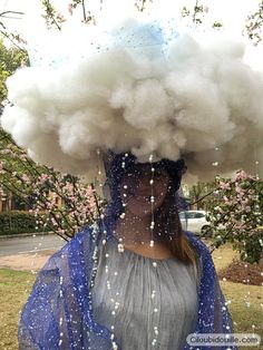 a woman with a cloud on her head