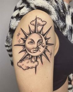 a woman with a sun and moon tattoo on her upper arm, in black and white