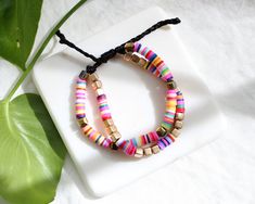 more cute and fun necklaces and earrings in DearDanielleJewelry: https://www.etsy.com/shop/DearDanielleJewelry?ref=seller-platform-mcnav§ion_id=28417638 🌈 Rainbow Surfer bracelet. heishi beads bracelet. rainbow polymer beads double string bracelet. Multicolor rubber beads heishi bracelet. Pulltie bracelet(adjustable). Please pick pulltie color: Grey pull tie with Silver beads and multi heishi beads(only one available) Tan pull tie with Gold beads and multi heishi beads **framed gems, and charms Bracelet Heishi, Fun Necklaces, Rubber Bead, Heishi Bracelet, Bracelet Rainbow, Surfer Bracelets, Polymer Beads, Rainbow Beads, Heishi Beads