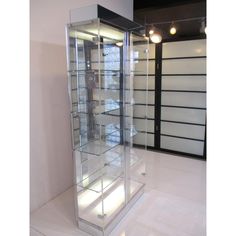 an empty glass display case in a room