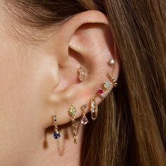 a close up of a person with ear piercings on their left and right ears