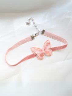 Life is just more magical with our pink butterfly choker necklace. Made for princesses, little ladies, and fashion-loving girls, this must-have accessory is as lovable as your cutie pie.   Clasp and chain link closure offer an adjustable fit that feels comfy even for all-day wear. Just the thing to complete multiple costumes, formal dresses, and make-believe outfits  Pink choker necklace with butterfly accent and clasp closure  Includes one necklace in one size that fits most toddlers and young girls Not intended for sleepwear. Please supervise the child while they are wearing the accessory. Pink Adjustable Choker As A Gift, Pink Choker For Valentine's Day Gift, Pink Butterfly Charm Necklace For Party, Pink Butterfly Necklace For Party, Pink Party Jewelry With Butterfly Knot Detail, Pink Party Jewelry With Butterfly Knot, Adjustable Pink Butterfly Jewelry, Cute Butterfly-shaped Jewelry For Parties, Adjustable Butterfly Charm Necklace For Party