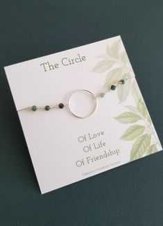 The Circle: Of Love, Of Life, Of FriendshipThe circle has long been symbolic of eternity and infinity and makes a timeless piece to wear and gift to someone close to you.A Sterling Silver eternity circle is joined to natural raw Emeralds. Emeralds are wire wrapped together with sterling silver wire. This bracelet makes a dainty statement and is also a great piece to layer and create a look of your own. Circle is 18 mm. Choose size or adjustable from the drop down box.*Listing is for one Silver E