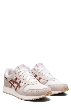 A versatile sneaker features a leather and mesh upper accented with retro branding, while an EVA midsole provides comfort and support. Synthetic and leather upper/ synthetic lining and sole Removable insole Imported Asics Lyte Classic, Retro Branding, Shoe Women, Athletic Shoe, Womens Athletic Shoes, White Rose Gold, Curator Style, Saucony Sneaker, Athletic Shoes