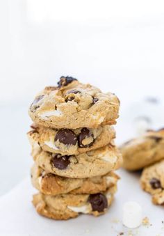 a stack of cookies with chocolate chips and marshmallows