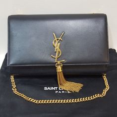 Authentic) Ysl Saint Laurent - Black Used Very Gently There Is Natural Wear Of The Leather(Like It Shows In The First Picture) No Damage, No Rust. Free Poshmark Authentication. Include: Dustbag, Authenticity Card Medium Kate Monogram Leather Tassel Chain Shoulder Bag Effortlessly Elegant In Smooth Leather, This Chain Bag Feature A Delicate Metal Tassel And Iconic Insignia In A Nod To The Yves Saint Laurent Heritage Magnetic Snap-Flap Closure Pull-Through Chain Strap Interior Wall Pocket Calfskin Leather Made In Italy 9 ½"W X 5 ¾"H X 2"D 10 ½" Strap Drop; 18" Shoulder Strap Drop Ysl Fringe Bag, Ysl Purse Black, Saint Laurent Leather Chain, Ysl Chain Wallet, Ysl Crossbody Bag Black Tassel, Ysl Saint Laurent, Monogrammed Leather, Chain Bag, Interior Wall