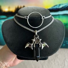 Handmade . Double Layer Necklace . Vampire Bat Wings And Black Onyx Bullet Charm . Wheat Chain Style Are Stainless Steel Material ( Nickel Free , Allergy Free , Hypoallergenic , No Itching , Do Not Change Color ) First Layer With O Ring Is 14 Inch Long And Second Is 16 Inch Long ( Necklace Is Adjustable And Has A 3 Inch Extention On The Back As Well To Wear Longuer If Needed ) Tags : Gem / Gems / Gemstones / Crystals / Boho / #Bohemian / Bohochic / Goth / #Gothic / Punk / Emo / Victorian / Queen / Viking / Celt / #Celtic / #Vampire / Bats / Wings / Dracula / Moon Child / Witch / Fairy / Mermaid / Unicorn / Rock & Roll / Rocker / Rock Chic / Biker / Gift / Stylish / Trendy / Festival / Design Celtic Vampire, Bats Wings, Alt Jewelry, Necklace Vampire, Victorian Queen, Witch Fairy, Vampire Bats, Goth Choker, Mermaid Unicorn