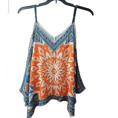 Lively Floral Print Hankerchied Top By Jealous Tomato. Vibrant Shades Of Coral, Orange Peach, Aqua Blues & Off White/Beige. Adjustable Speghetti Straps.. Loose & Flowy Relaxed Fit So It Fits Xs S M Perfect For Summer Outings, Poolside Beach Backyard Bbq Cookouts. Vacay & Festivals Too. Nwot -Brand New Polyester V-Neck Adj Spaghetti Straps 19.5" 25/31" Lengthens To 32/37" Free Shipping Plus 10% All Bundles $10 Off Your First Poshmark Purchase Sign Up Code Poshgramgirl Summer Vacation Travel Weeke Orange Flowy Top For Summer, Flowy Orange Summer Top, Orange V-neck Top For Festivals, Summer Orange Vibrant Tops, Flowy Orange Top For Vacation, Vibrant Orange Beach Top, Vibrant Orange V-neck Top, Bohemian Blue Tops With Spaghetti Straps, Orange Beach Top With Colorful Pattern