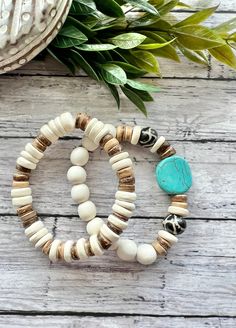 Choose to wear alone or as a stack!  A beachy, boho wood, turquoise and African bone bead bracelet. Sold individually.  They measure appropriately 7.25-7.5 inches. Made with strong stretchy cord.  Thanks for checking out Beaded Blues! Bohemian Beaded Bracelets With Wooden And Heishi Beads, Bohemian Stretch Bracelet For Everyday, Adjustable Bohemian Stretch Bracelet With Wooden Beads, Bohemian Turquoise Beaded Bracelets With Wooden Beads, Bohemian Bracelets With Wooden And Heishi Beads, Bohemian Brown Bracelets For Vacation, Spiritual Stackable Stretch Bracelet For Beach, Bohemian Stretch Bracelet For Vacation, Adjustable Turquoise Bracelets With Wooden Beads