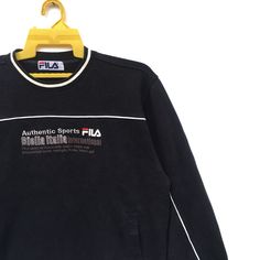 PLEASE ASK ANY QUESTION BEFORE BUYING THIS IS USED CLOTHING PLEASE DONT EXPECTED IT TO BE LIKE NEW OR IN PRISTINE CONDITION Rare!! Fila Sweatshirt | Fila Small Logo Embroidery Spell Out Sweater Size Medium tag Fila material cotton 100% saiz on tag XL (xlarge) Mesasures About ( Approximately) -Armpit to Ampit : 21.5 inch -Length (back collar down) : 24.5 inch Condition : used good condition 8/10 **No Tears No Stains And No Hole** Sporty Long Sleeve T-shirt With Embroidered Logo, Winter Sports Tops With Embroidered Logo, Black Tops With Embroidered Logo For Sports Season, Sporty Crew Neck Tops With Embroidered Logo, Athleisure Tops With Embroidered Logo, Sportswear Crew Neck Top With Embroidered Logo, Sportswear Tops With Embroidered Logo And Crew Neck, Sportswear Tops With Embroidered Logo, Crew Neck, Crew Neck Top With Embroidered Logo For Sports Season