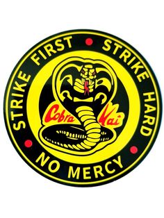 the cobra logo on a black background with yellow lettering and an image of a snake