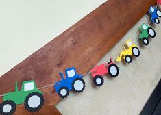 this is an image of a birthday decoration with tractor paper garlands on the floor