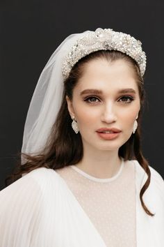 a woman wearing a veil and tiara