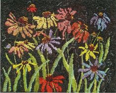 an embroidered rug with flowers on it