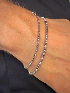 Elevate your style with our men's silver-tone stainless steel chain bracelet. Crafted from durable stainless steel, this bracelet is resistant to corrosion and tarnish, ensuring long-lasting shine and reliability. Features: - Material: Stainless Steel - Color: Silver-Tone - Sizes: Available in various lengths for a perfect fit This bracelet is perfect for both everyday wear and special occasions, easily pairing with other accessories and jewelry. The secure clasp ensures comfort and safety. Add Silver Cuban Link Bracelet, Tarnish Resistant For Everyday, Silver Tarnish Resistant Cuban Link Bracelet For Everyday, Silver Tarnish-resistant Cuban Link Bracelet For Everyday, Silver Tarnish-resistant Cuban Link Bracelet, Silver Tarnish-resistant Bangle Chain Bracelet, Durable Metal Bracelet For Gift, Silver Tarnish-resistant Chain Bangle, Silver Link Bracelets Tarnish Resistant, Silver Link Bracelet Tarnish Resistant