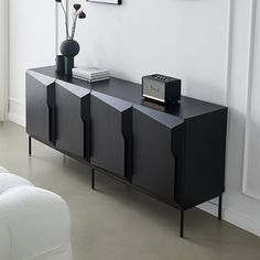 a black and white sideboard in a living room